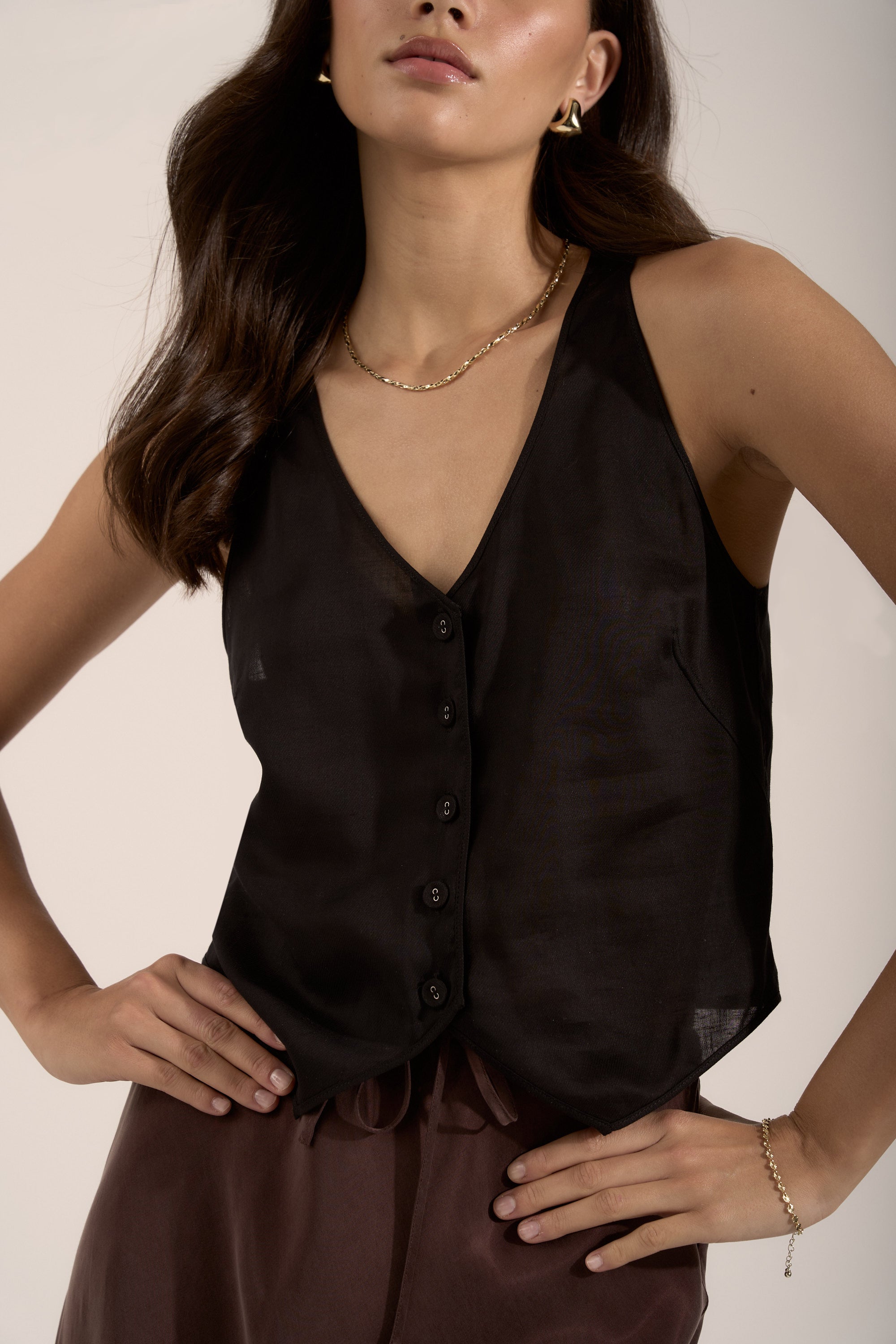 Max Tia Sheer Vest Top styled with brown pants—your spring essential look.
