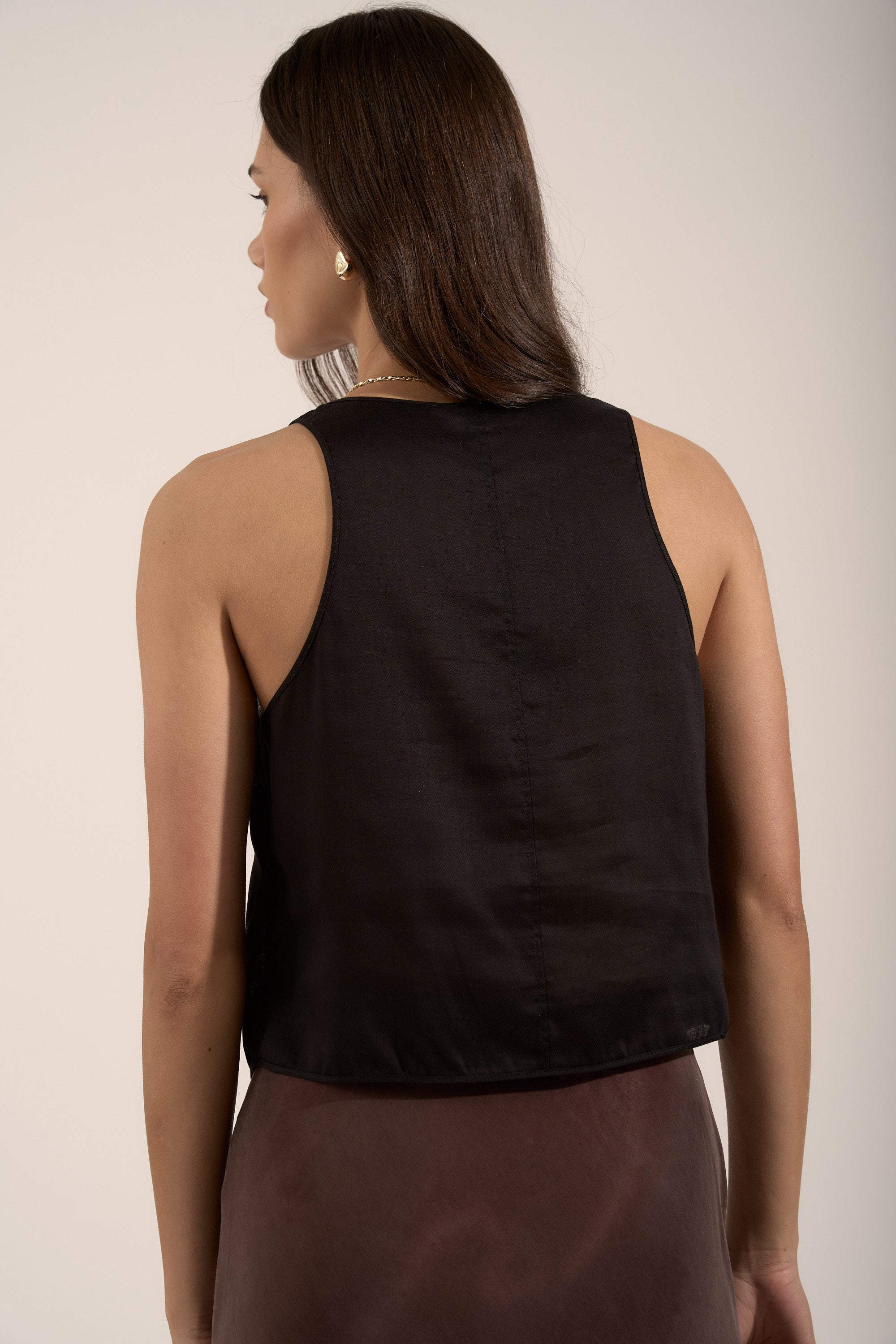 Model wears the Max Tia Sheer Vest Top in black, shown from the back against a neutral background.