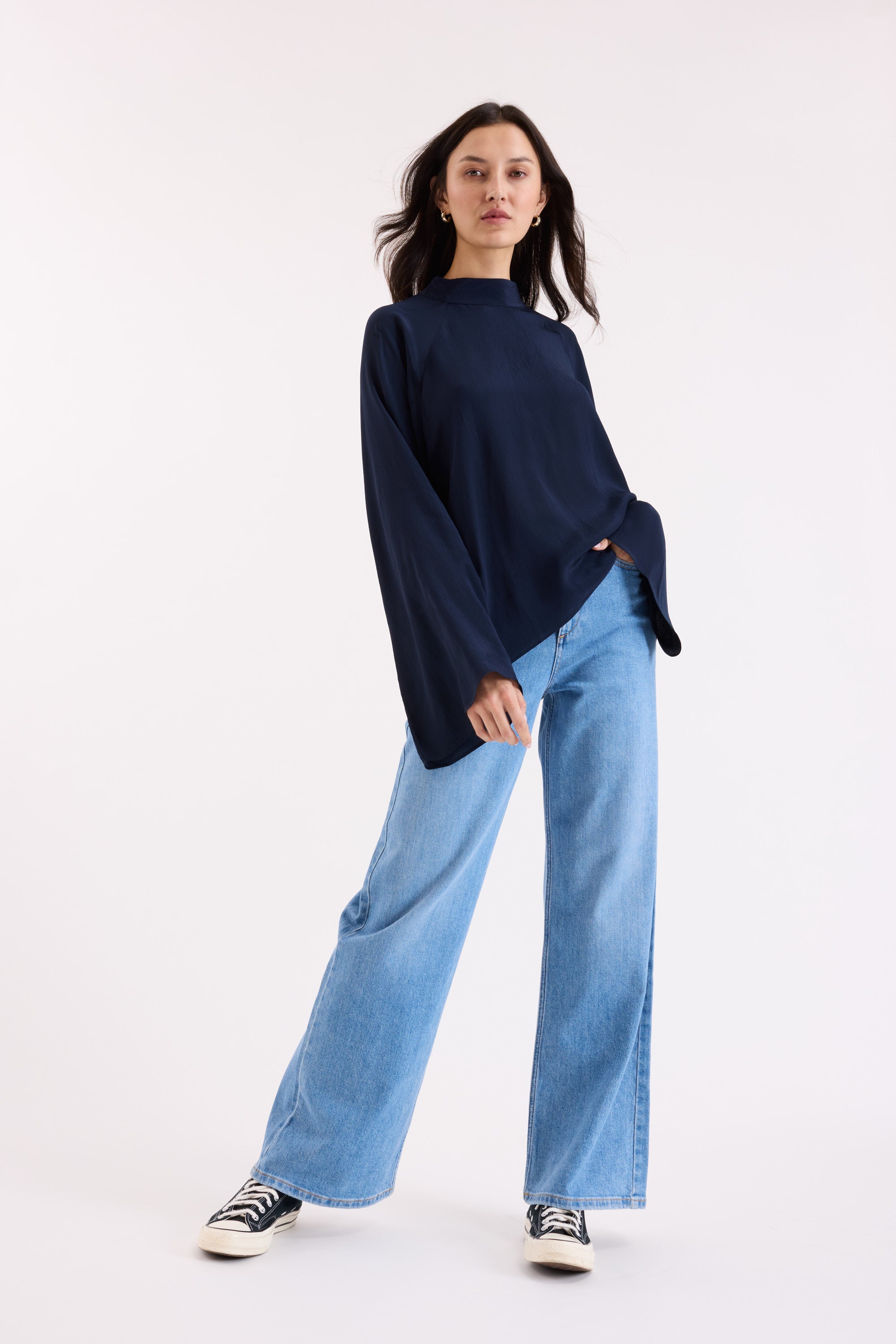 Model wears the Max Lindsay Textured Blouse with wide-leg jeans against a plain white background.