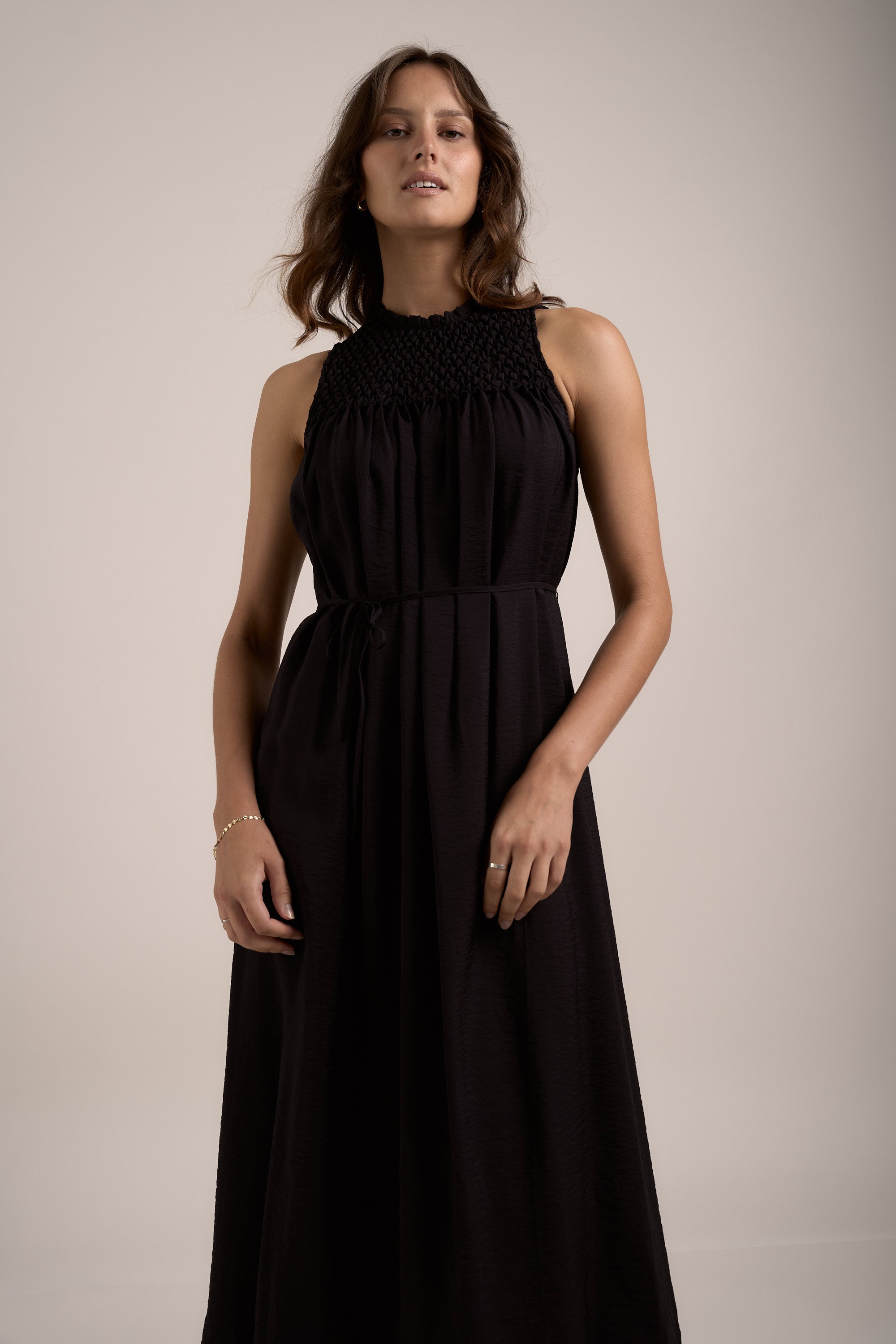 Woman wearing the Max Sherry Smock Detail Dress, sleeveless, against a plain light background.