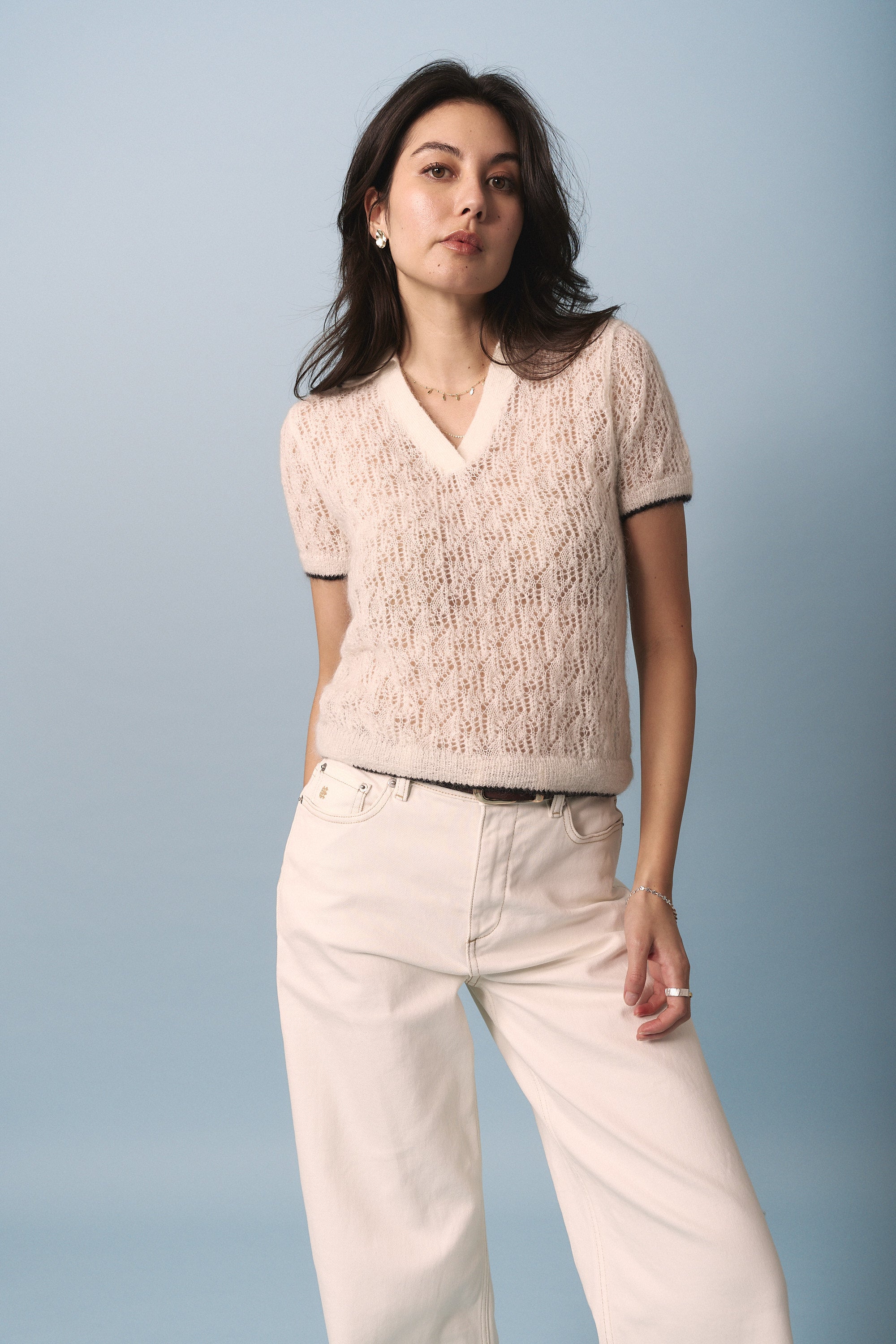 Model wears the Max Taylor Short Sleeve Knit against a light blue background.