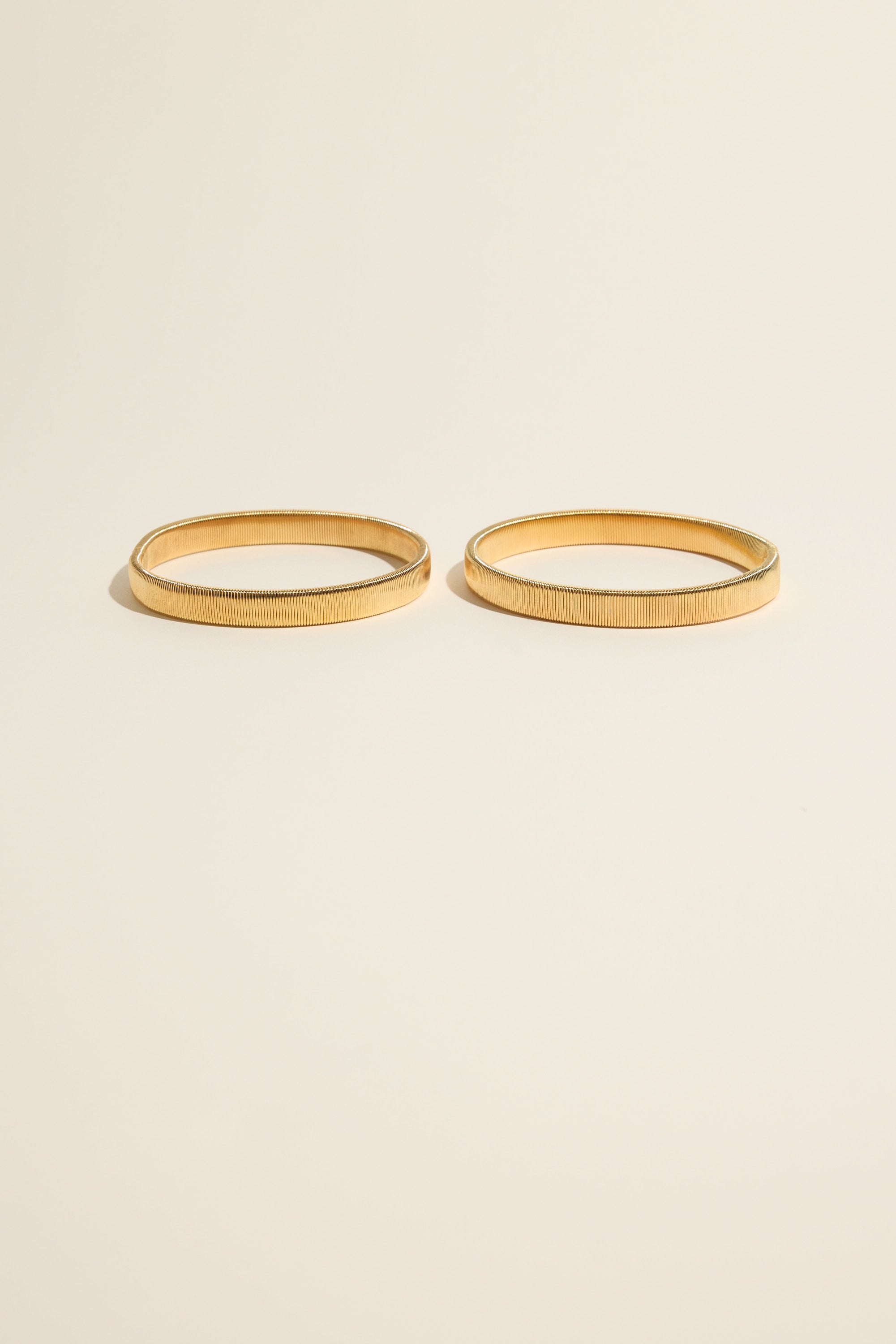 Max Sleeve Garter Pair: gold accessories to style your blazer or scrunch sleeves with flair.