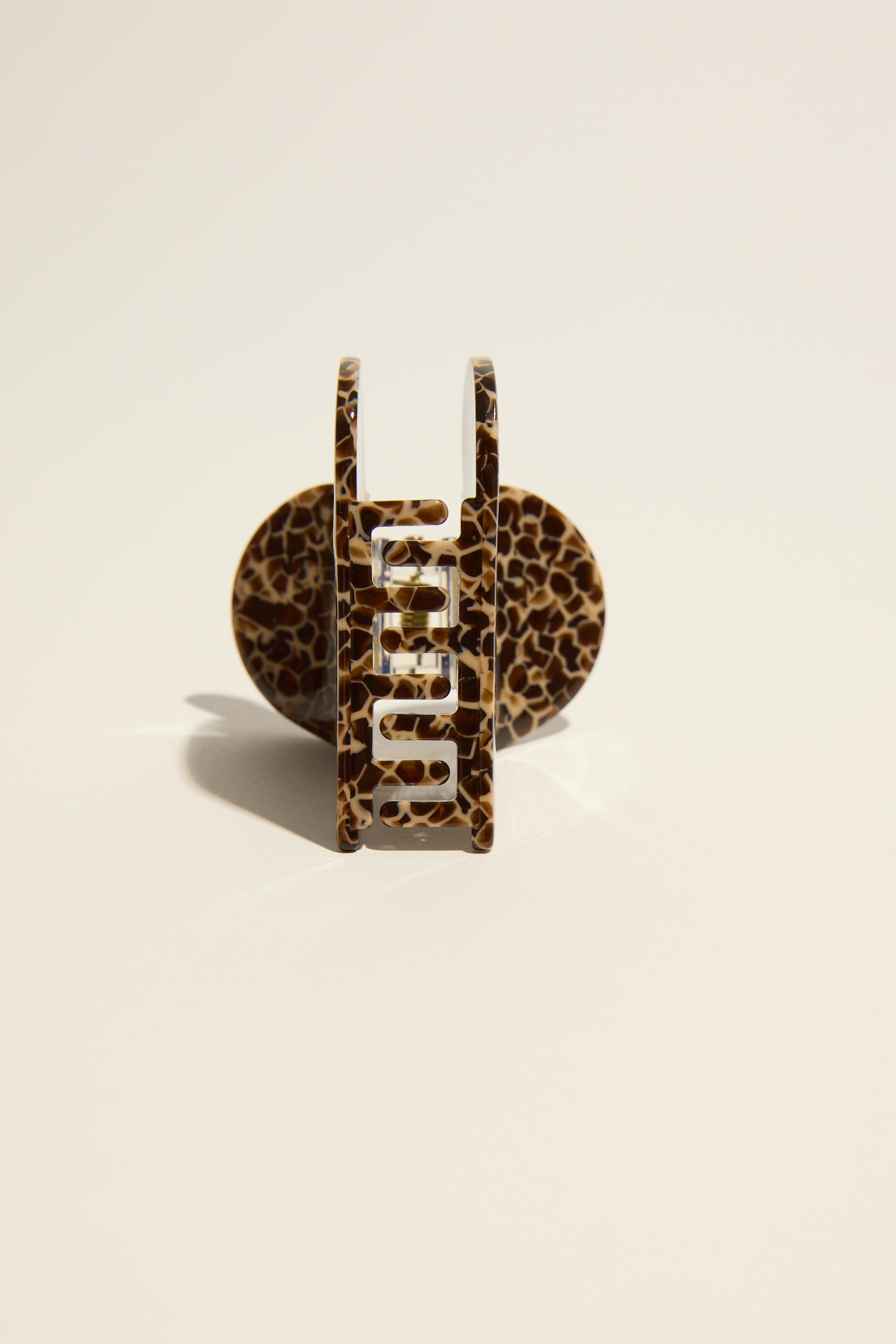 Darcy Heart Hair Claw by Max standing upright on a plain light background.
