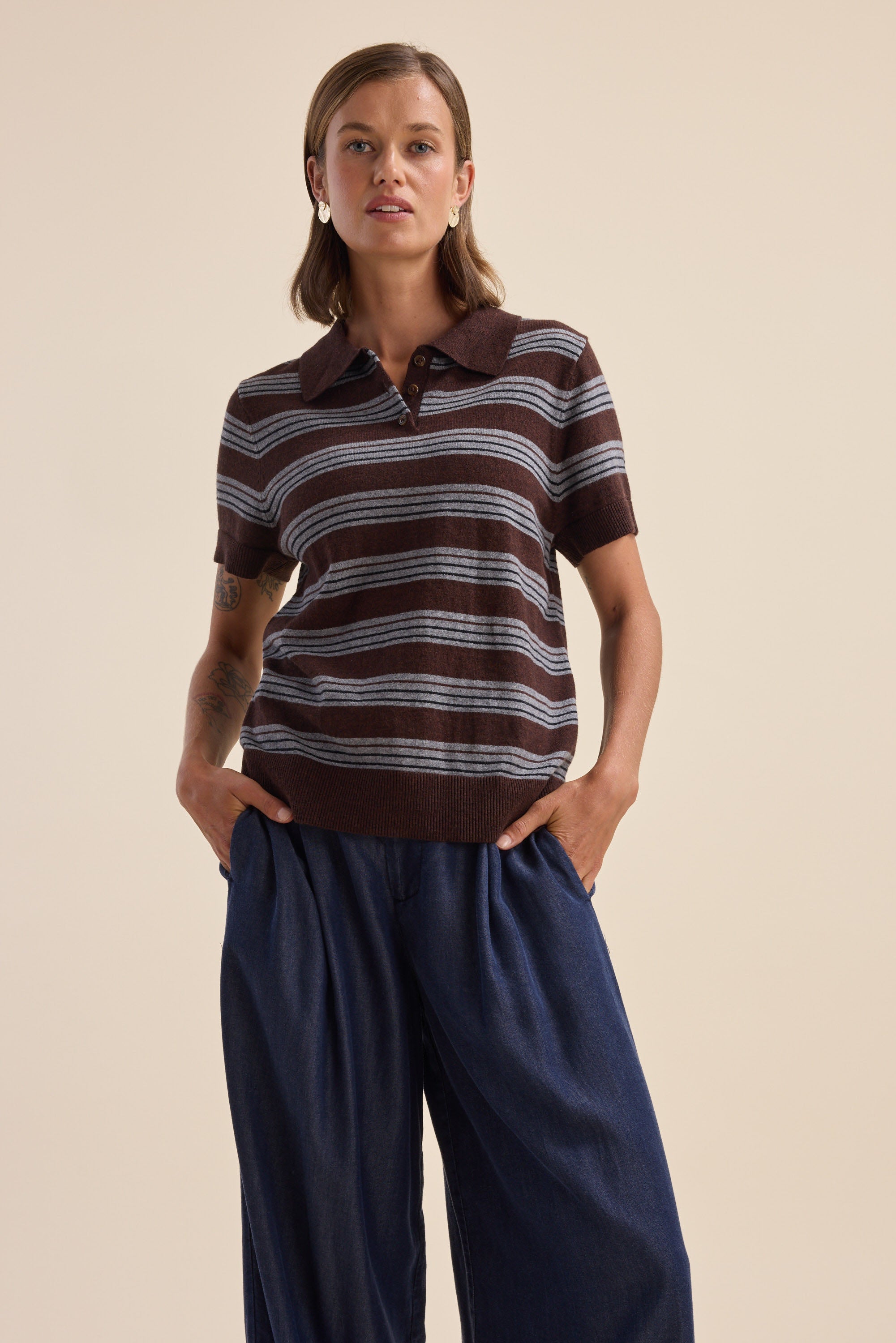 Woman in Elementary Cotton Cashmere Henley by Elementary, hands in pockets.