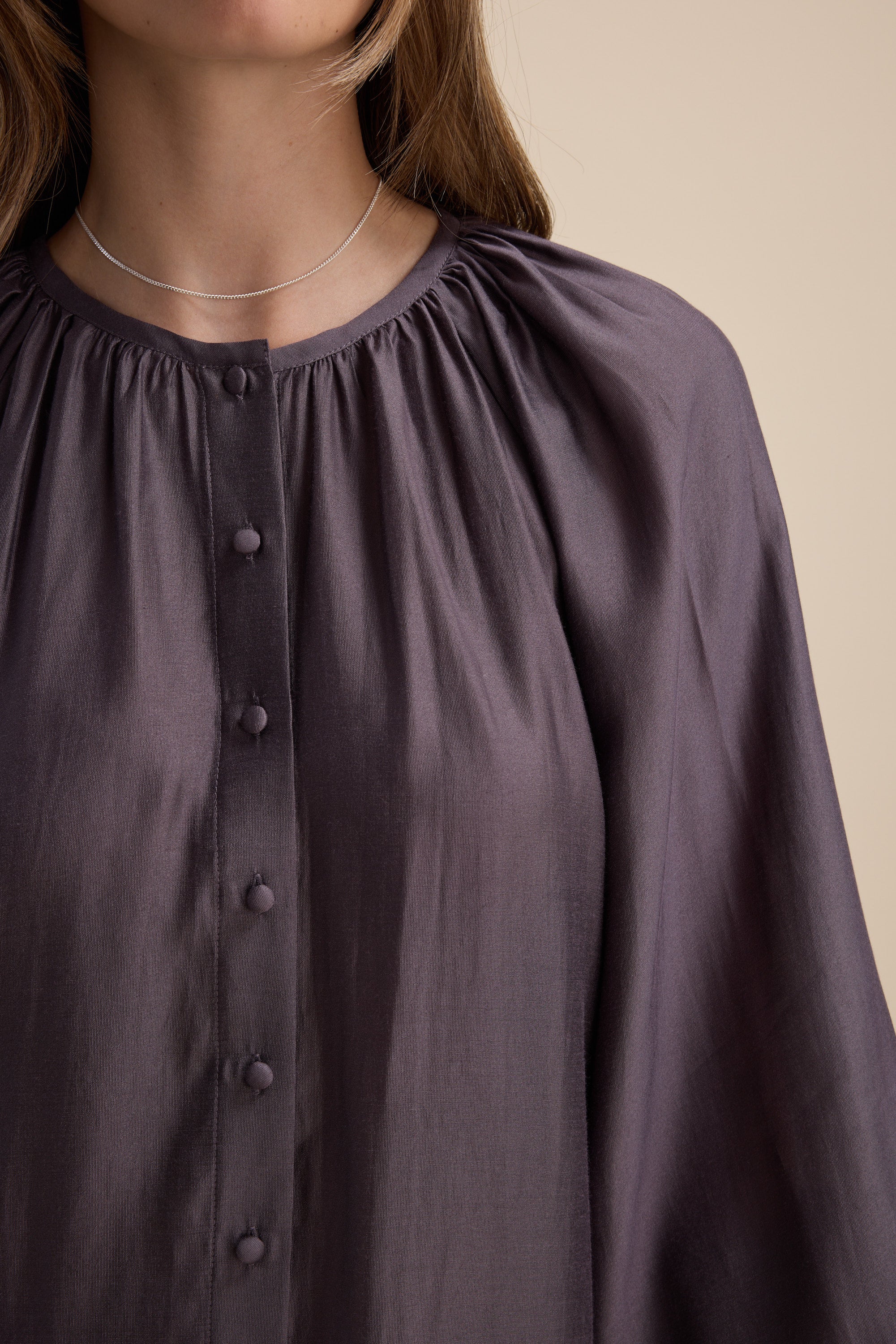 Model wears Max Vivian Button Front Blouse in organic cotton, styled with a silver necklace.
