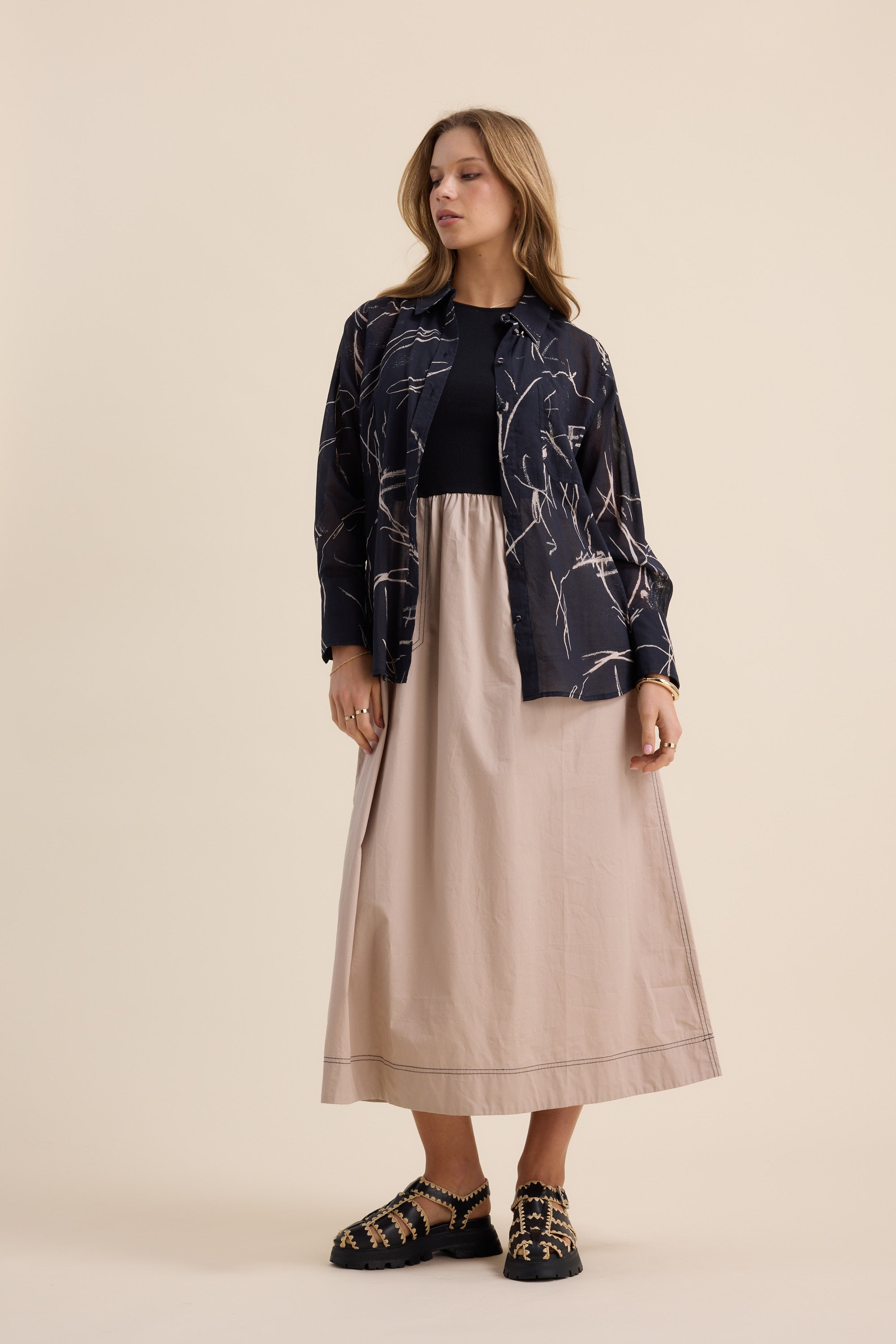Woman in The Stitch Detail Dress by Max poses.