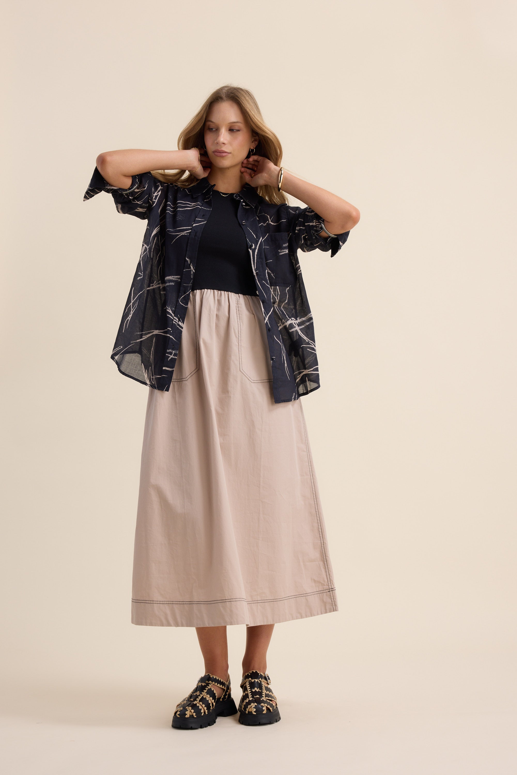 Woman poses in The Stitch Detail Dress by Max.