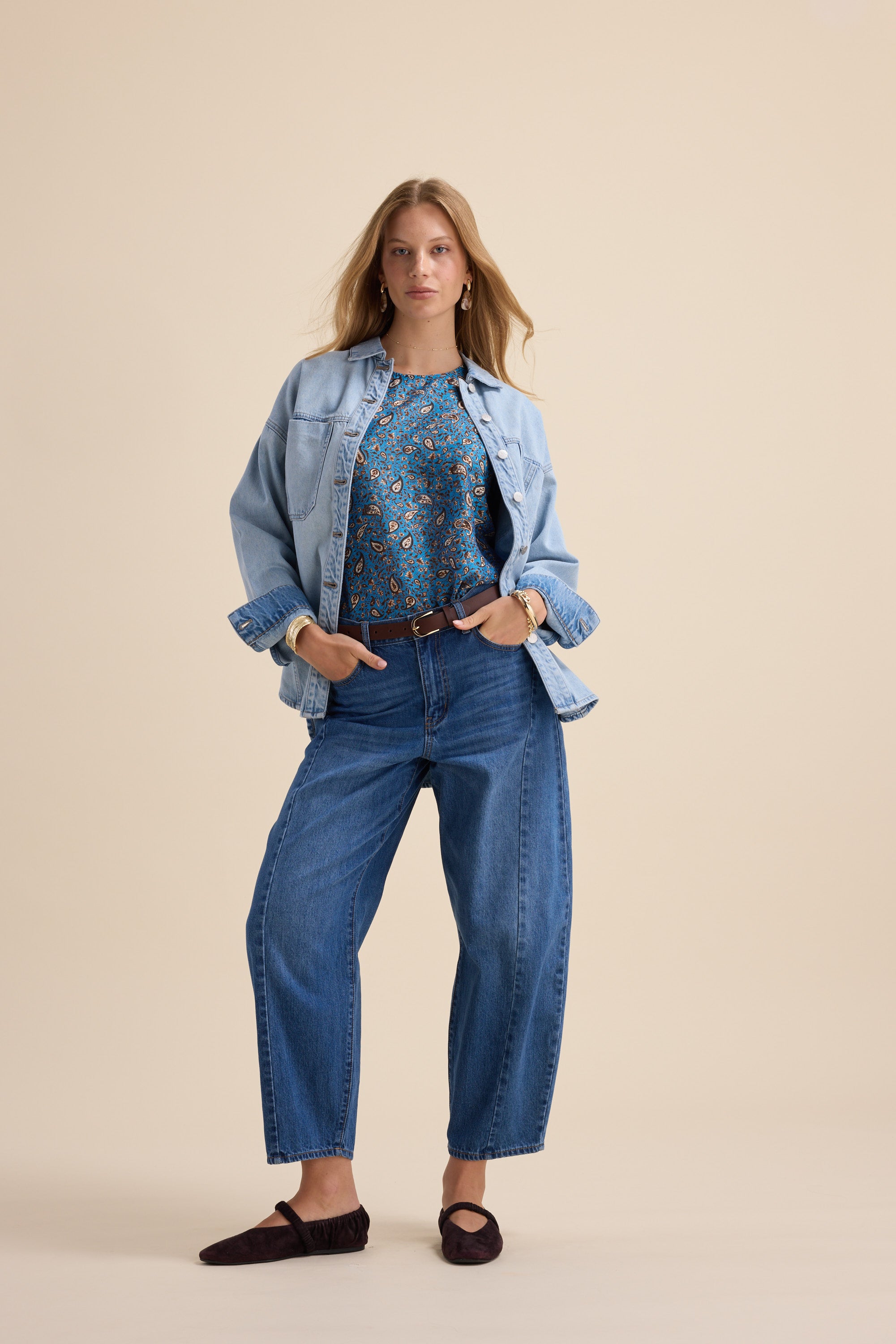 Woman in denim jacket and jeans wears Max Sydney Back Detail Top, standing hands in pockets.
