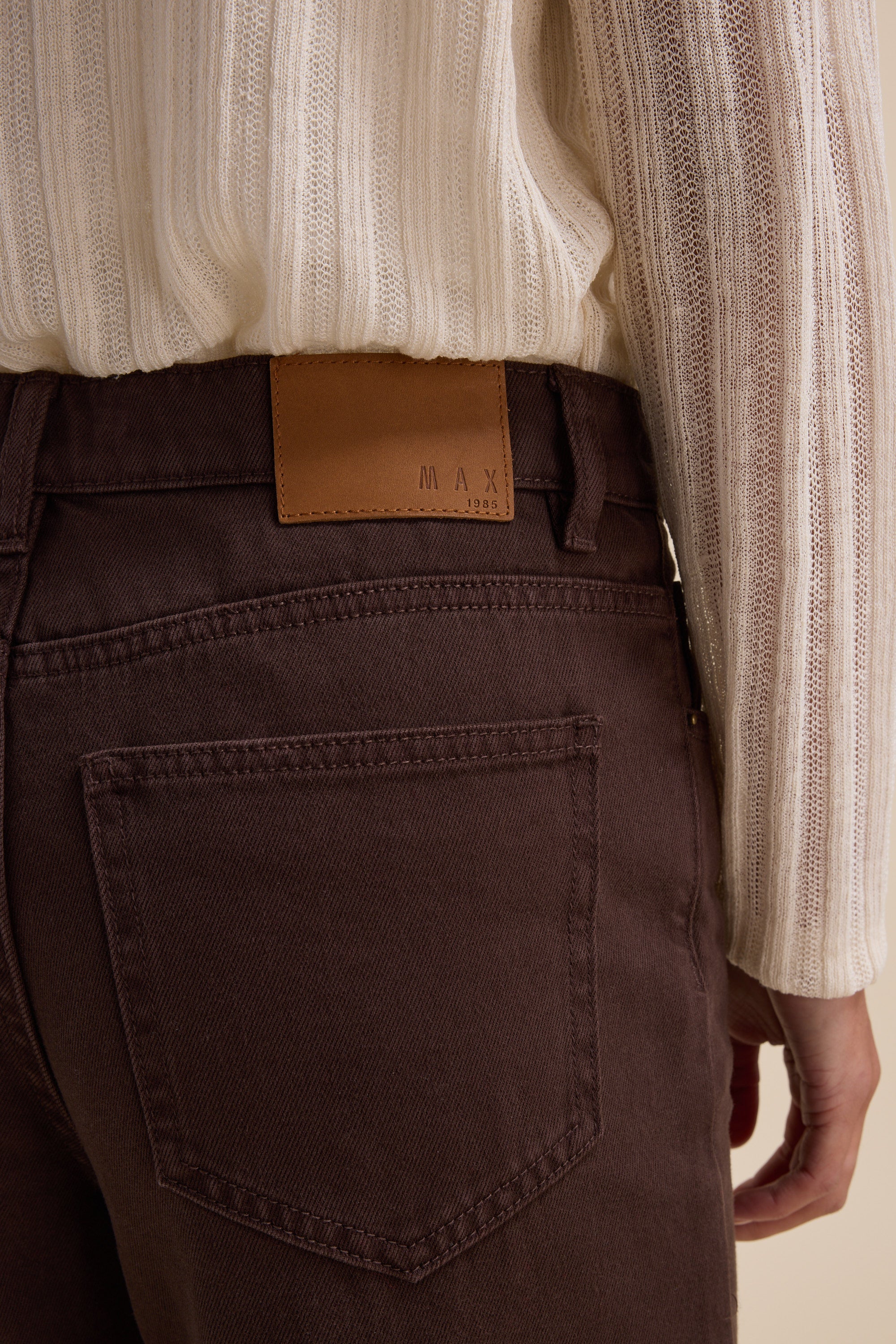 Person wearing Max Alaska Wide Leg Jeans, shown from the back waist down.