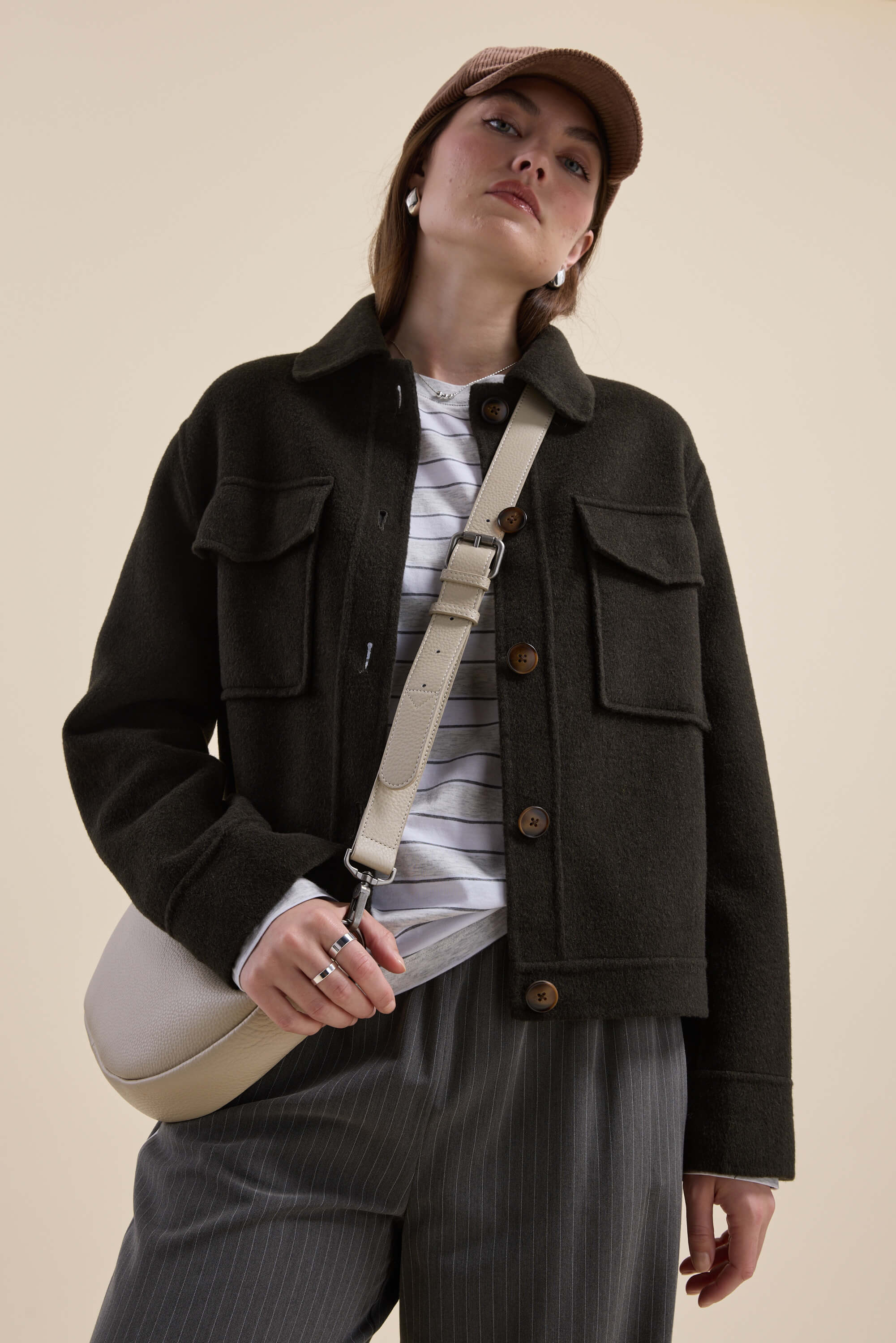 Person wearing the Max Kaia Wool Blend Cropped Coat, striped shirt, pinstriped pants, and cap.