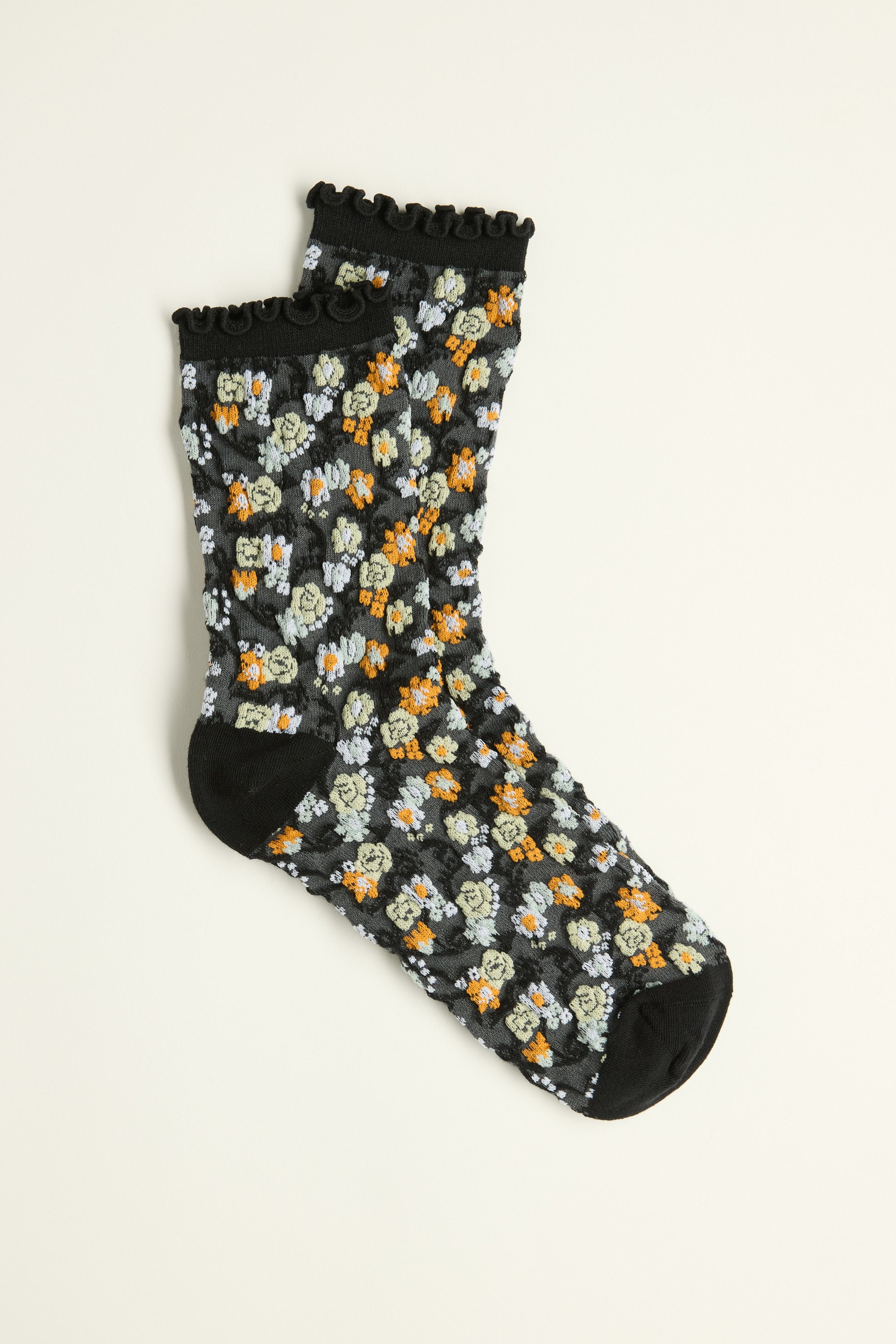 Jodi Floral Crew Socks by Max with lettuce frill trim and colorful orange, green, and white flowers.
