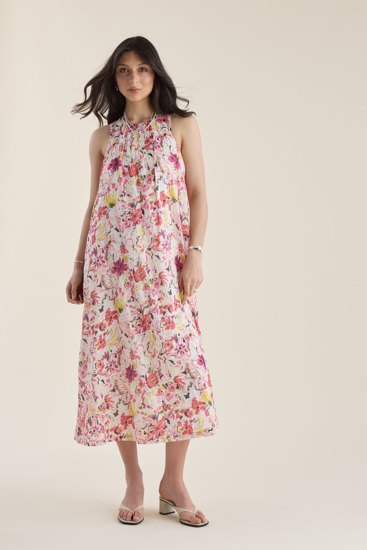 Woman in a Max Kira Back Detail Dress and sandals, featuring a stylish ankle-length silhouette.