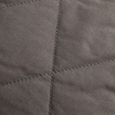 Close-up of NZ brown quilted fabric with diagonal and vertical stitching.