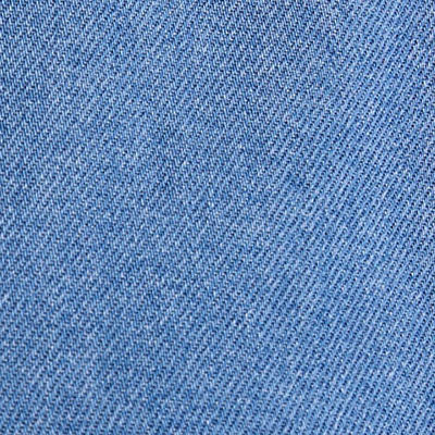 Close-up of NZ blue denim fabric with visible diagonal weave pattern.
