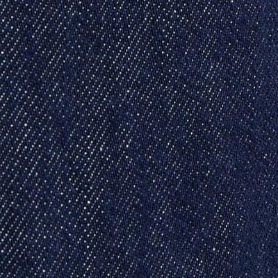Close-up of NZ dark blue denim fabric showing diagonal weave pattern and white specks.