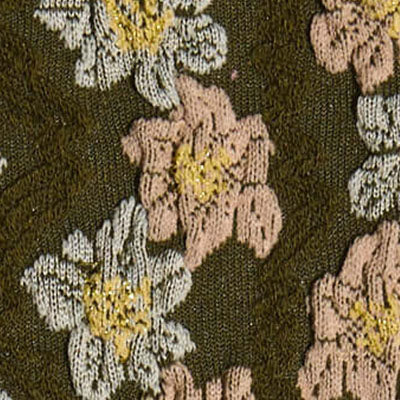 Close-up of fabric with embroidered pink, white, and yellow NZ flowers on a dark green background.