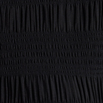 Close-up of black ruched fabric with horizontal gathered bands, designed in NZ.