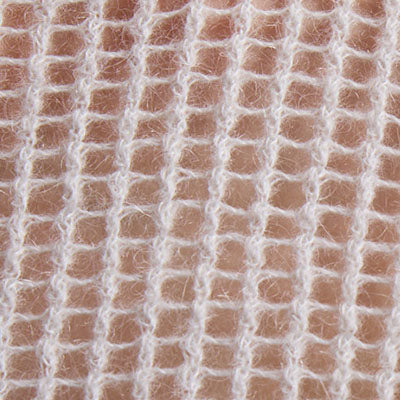 Close-up of white NZ gauze fabric showing its grid-like woven texture.