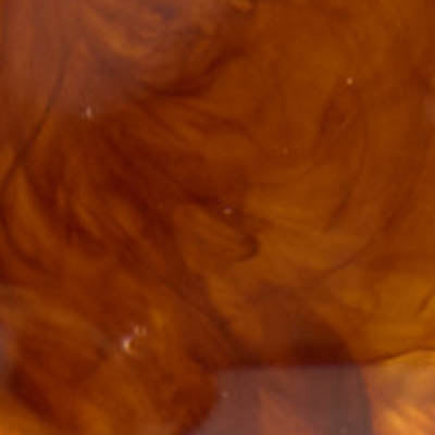 Swirls of brown and tan liquid, like NZ coffee mixing with cream.
