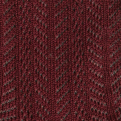 Close-up of a maroon NZ knitted fabric with a chevron pattern.
