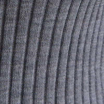 Close-up of gray ribbed fabric with vertical textured lines, inspired by NZ design.
