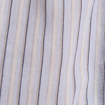 Close-up of NZ fabric featuring vertical beige and gray stripes on a light background.